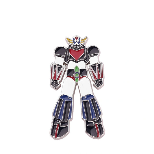 An enamel pin shaped like the Robotech M-102 Armageddon robot, featuring a white body with black, red, blue, green, and gold accents, set against a plain white background.