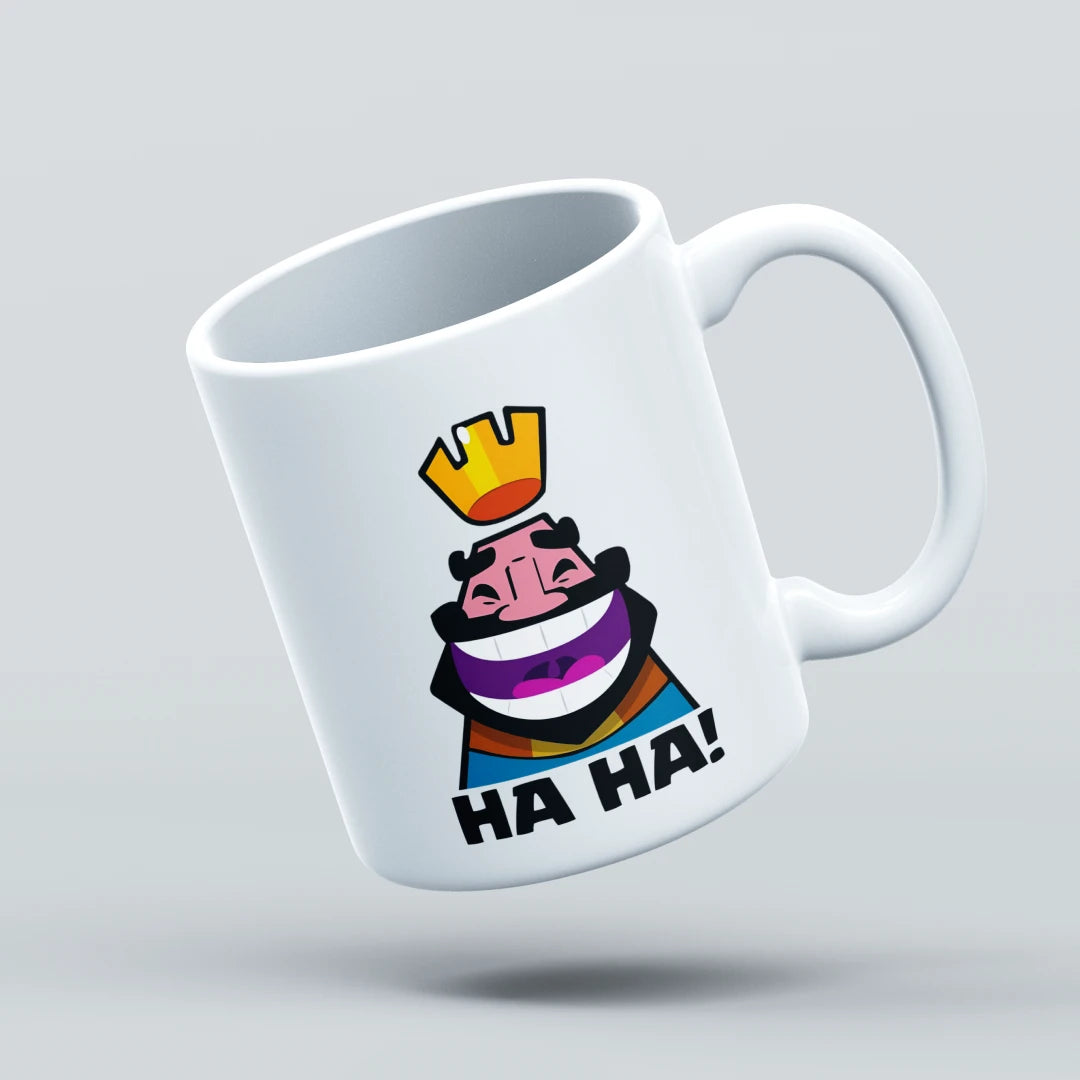 White mug with colorful graphic design and 'HA HA!' text on a light gray background