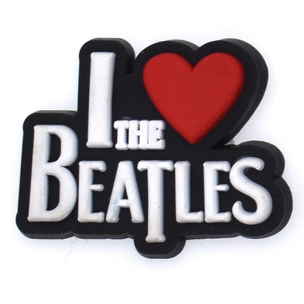 Emblem with 'I ❤️ The Beatles' text on a white background