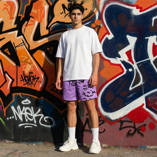Person wearing a white t-shirt and purple shorts standing in front of a colorful graffiti wall.