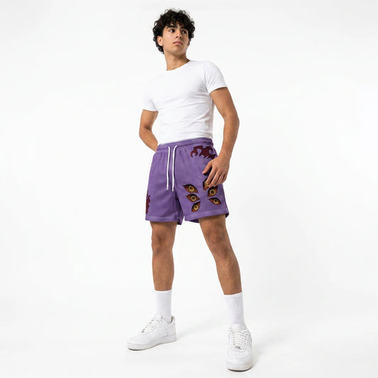 Person wearing purple shorts with decorative elements on a white background