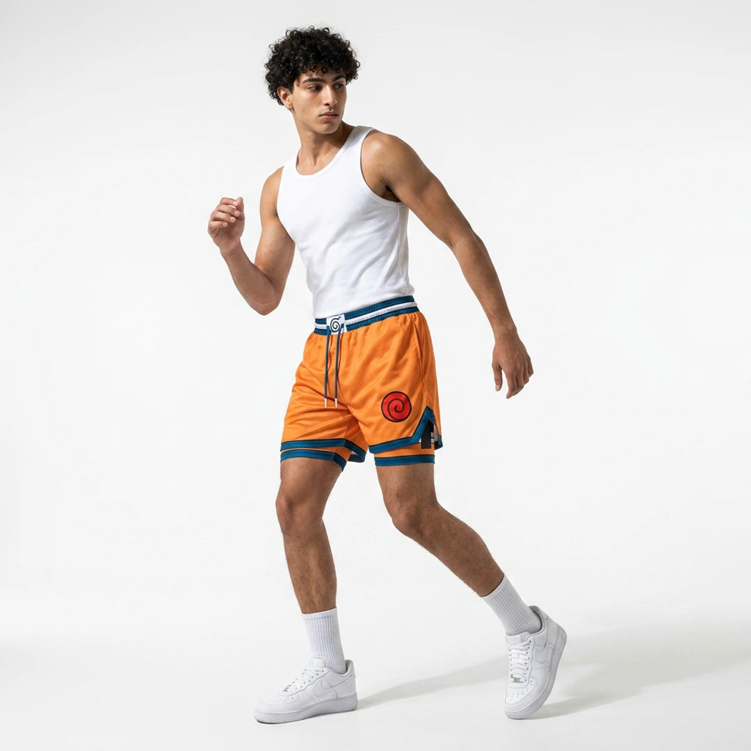 Person wearing orange shorts with a white tank top on a white background