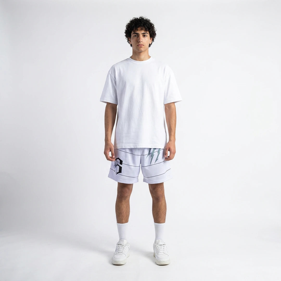 Person wearing a white t-shirt and shorts on a plain background