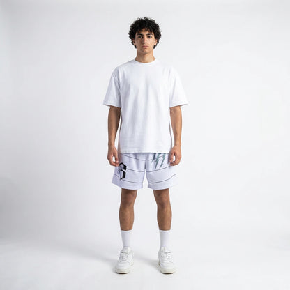 Person wearing a white t-shirt and shorts on a plain background