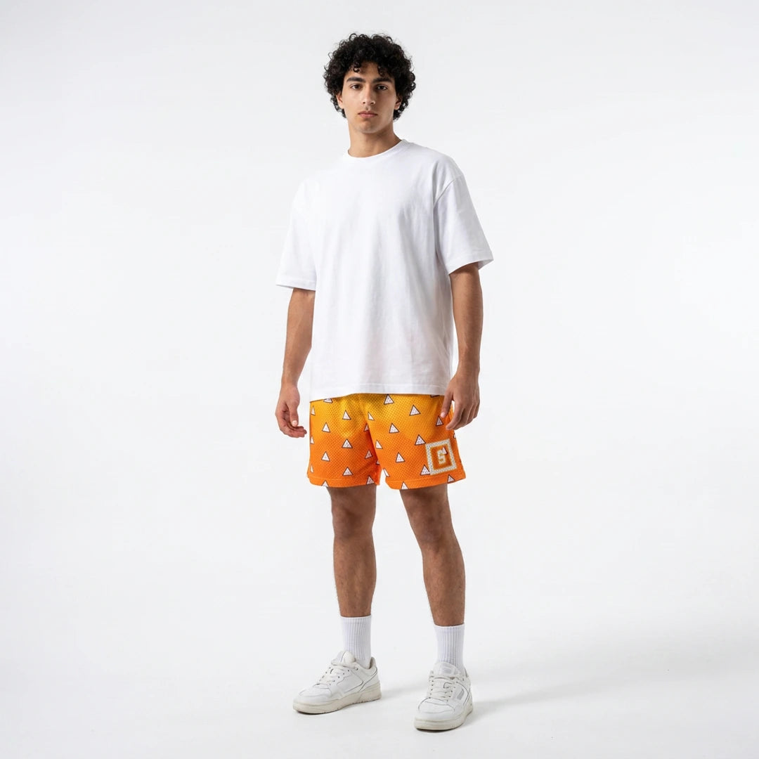Person wearing a white t-shirt and orange shorts with geometric patterns on a white background
