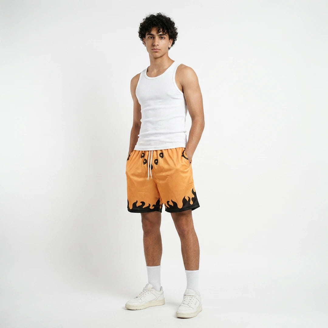 Person wearing a white tank top and orange shorts with black accents on a white background