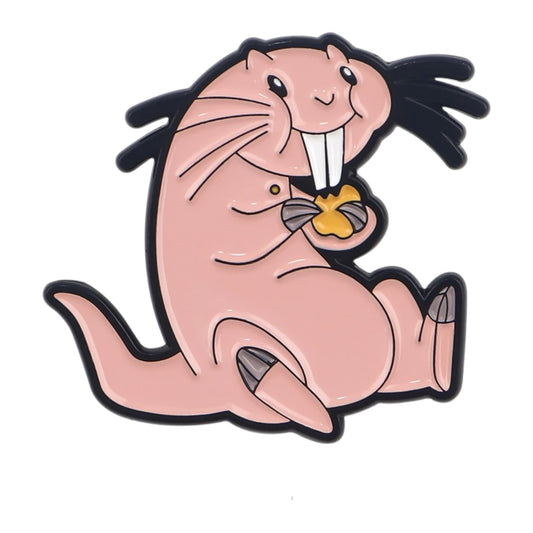 A cartoon walrus enamel pin on a plain white background. The walrus is light pink with black outlines, long black tusks, and a small yellow accent on its chest.