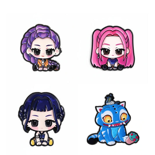 Four chibi-style character patches arranged in a 2x2 grid on a plain white background. The characters include purple hair, pink hair, dark blue hair, and a blue cat-like creature, each with bold black outlines and bright accent colors.