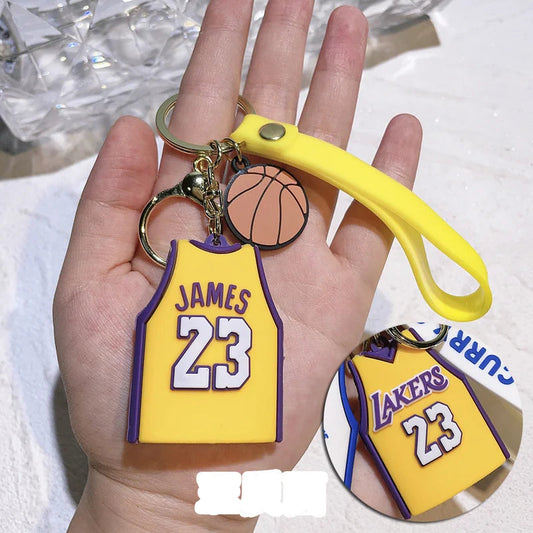 Keychain resembling a basketball jersey with 'JAMES 23' on a hand