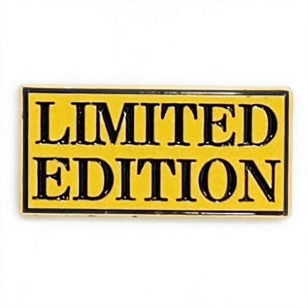 A rectangular enamel pin with a yellow background and black border, featuring the words 'LIMITED EDITION' in bold black capital letters.