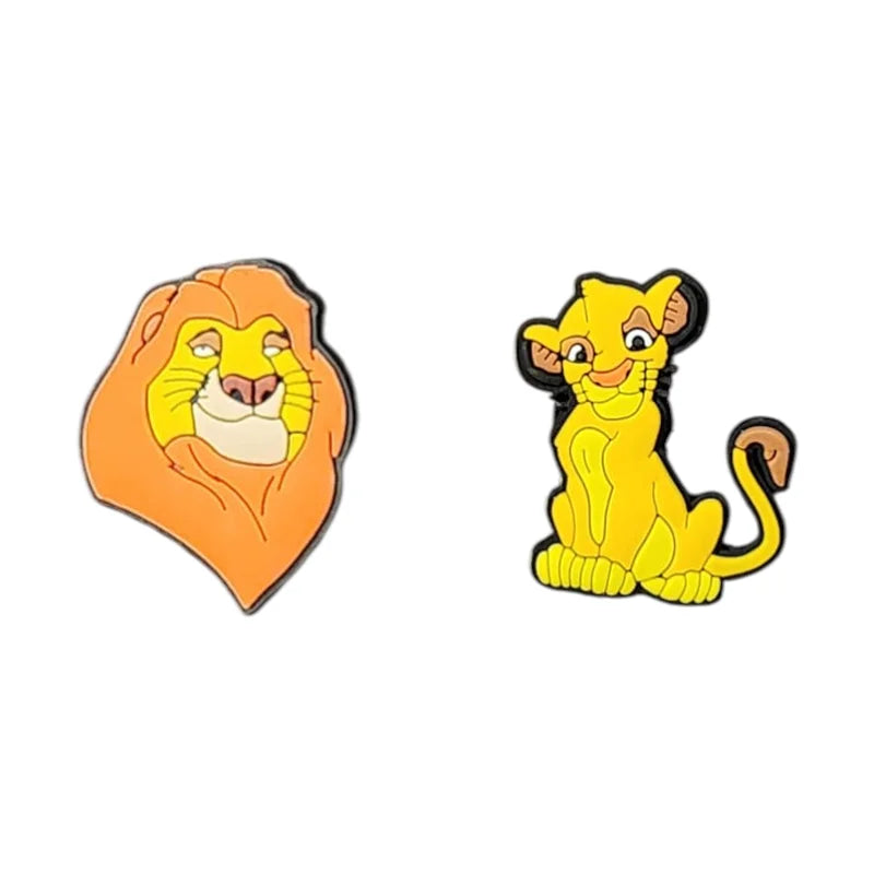 Two cartoon lion character pins on a white background