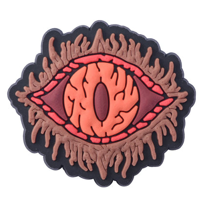 Decorative eye design with orange and brown colors on a white background