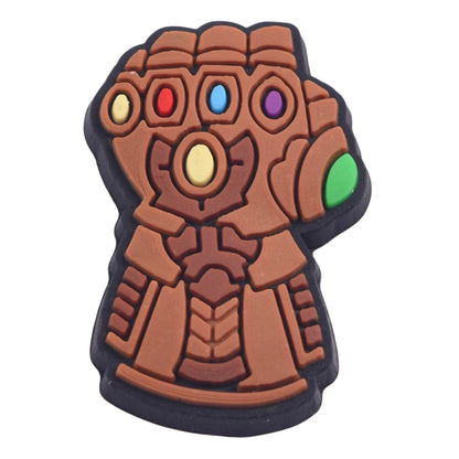 Glove-shaped object with colorful stones on a white background