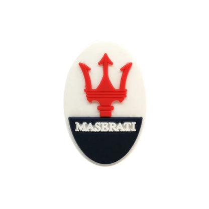 Maserati logo croc charm on a white background