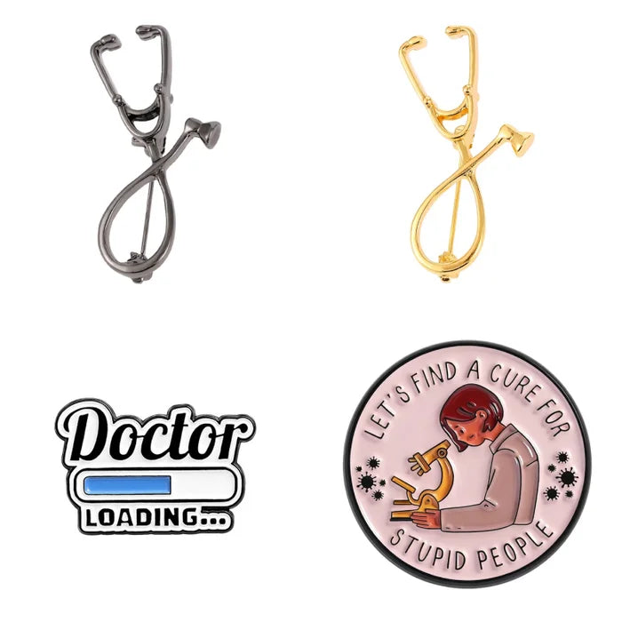 Two stethoscope-shaped pins, one silver and one gold, with a 'Doctor Loading.