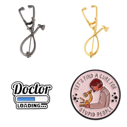 Two stethoscope-shaped pins, one silver and one gold, with a 'Doctor Loading.