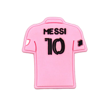 Pink soccer jersey with 'Messi 10' croc charm on a white background