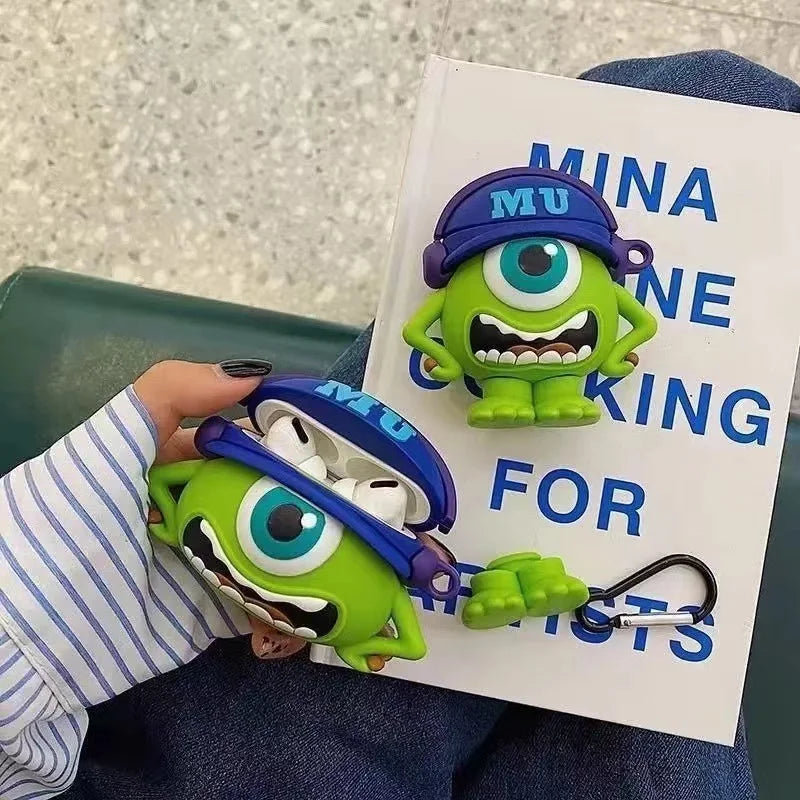 Green character toy with blue cap holding a case, next to a book titled 'Mina Ne King for Kids'.