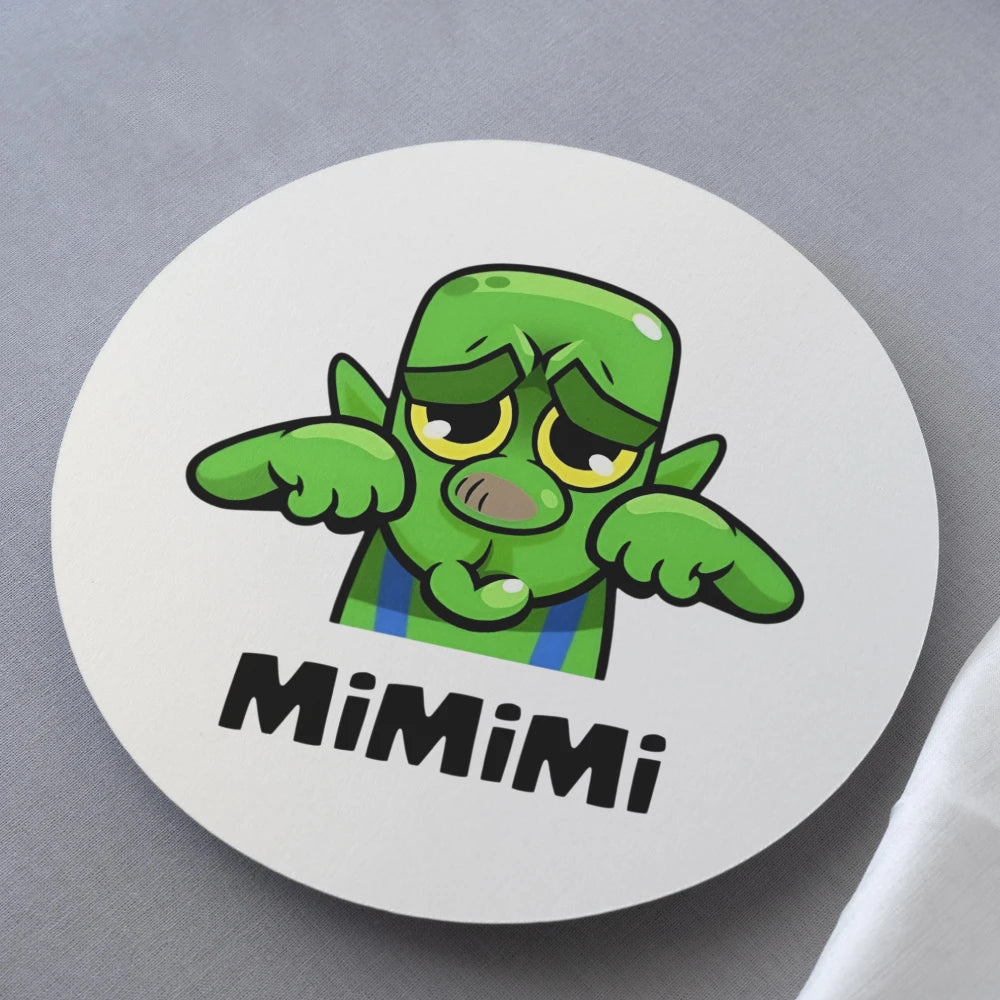 Circular white coaster with a green cartoon character and 'MiMimi' text on a gray background