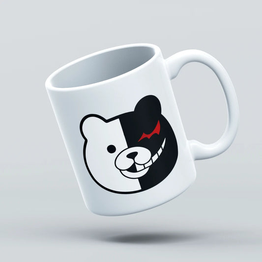 White mug with a black and white bear face design on a light gray background