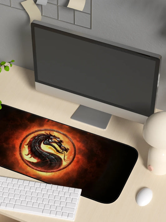 Desk setup with a computer monitor, keyboard, and mouse on a large dragon-themed mortal kombat mouse pad.