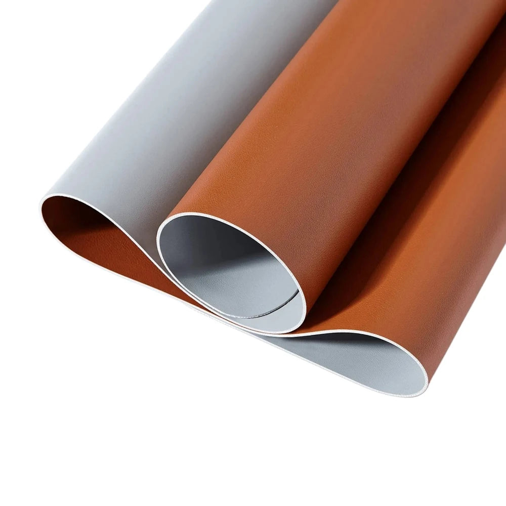 Two rolls of vinyl wrap, one gray and one brown, on a white background.