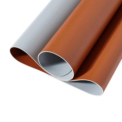 Two rolls of vinyl wrap, one gray and one brown, on a white background.