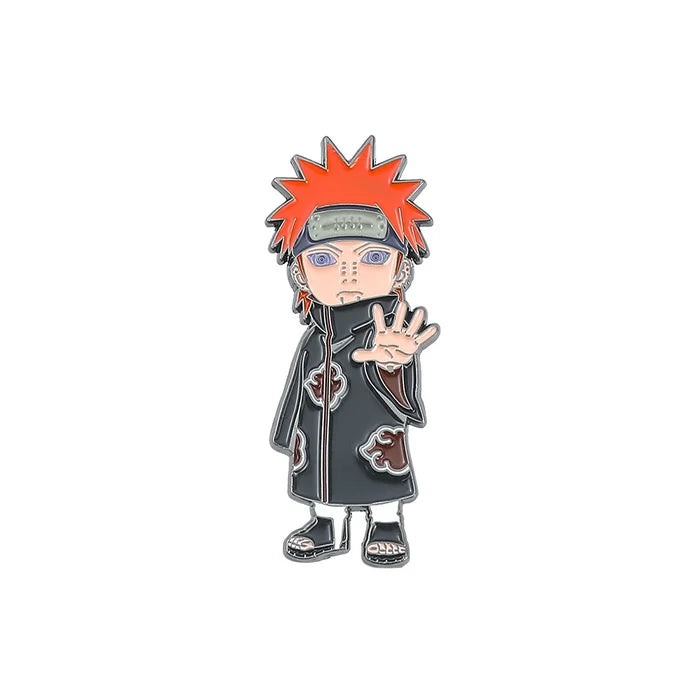 Pin featuring an animated character with spiky red hair and a black cloak on a white background