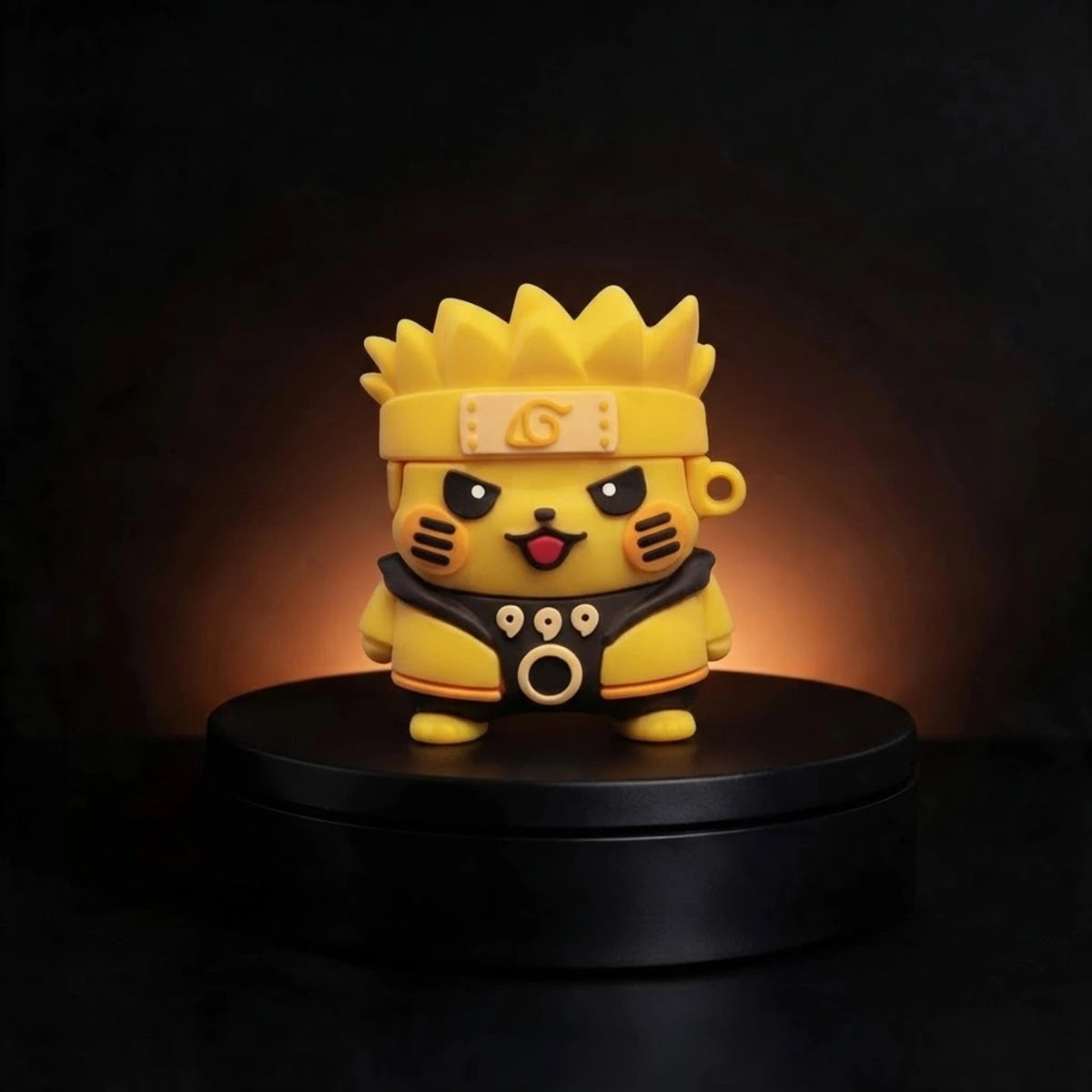 A yellow Pikachu-style character airpods case wearing a Naruto headband and black-and-gold outfit, standing on a black circular base against a dark background with warm light behind it.