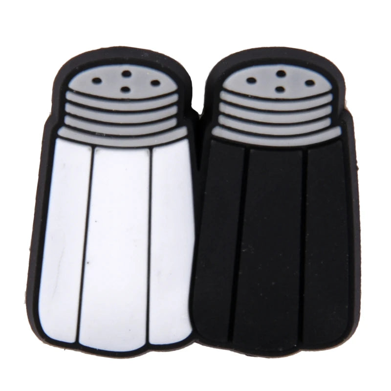 Black and white salt and pepper shakers on a white background
