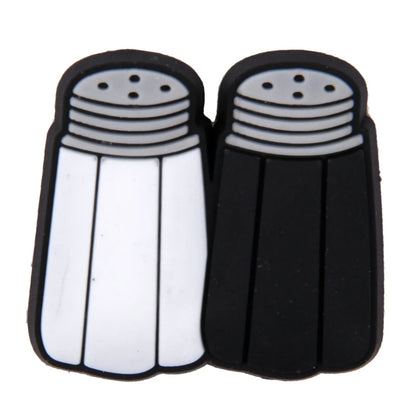 Black and white salt and pepper shakers on a white background
