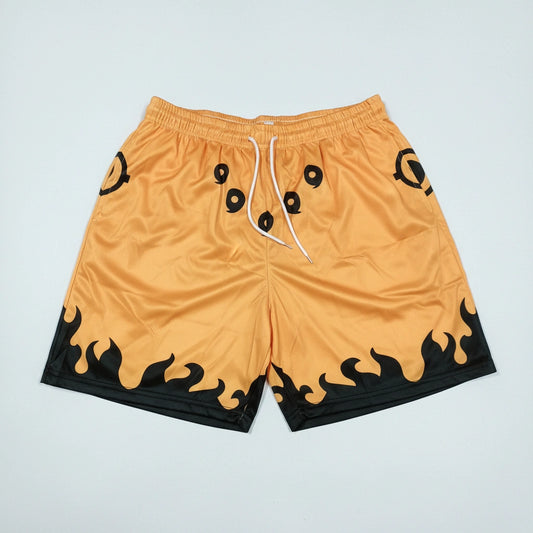 Orange shorts with black flame patterns on a light gray background