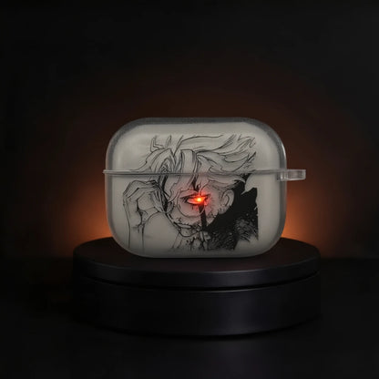 A translucent white rectangular airpods case with a black anime-style illustration from Dandadan featuring OKARUN and a glowing red eye, displayed on a black circular base against a dark background.
