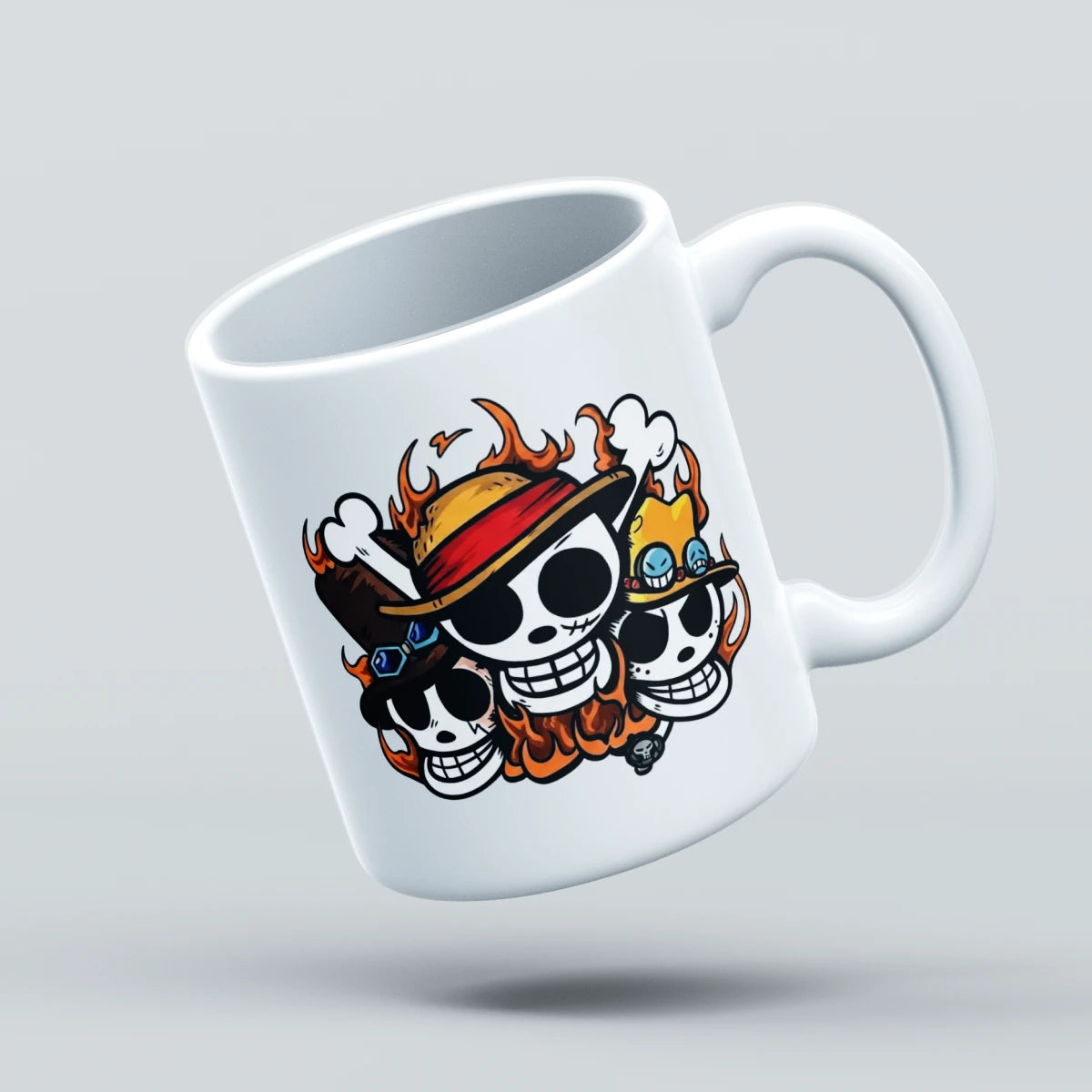 A white ceramic coffee mug featuring a cartoon graphic of three skulls wearing straw hats with flames, floating against a light gray background.