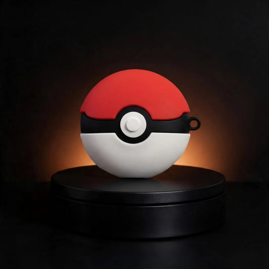 A red and white spherical device with a black horizontal band and central white button, styled like a Pokéball, displayed on a black circular pedestal against a dark background with warm light glow.