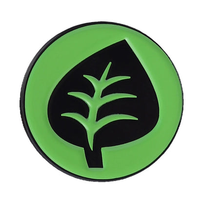 A circular green and black patch featuring a stylized leaf design, isolated on a white background.