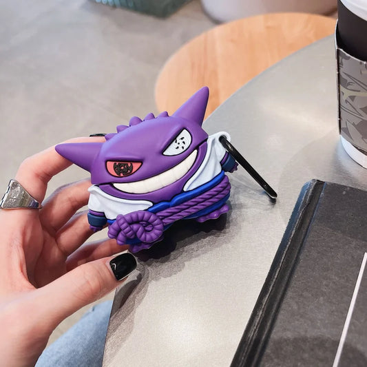 Person holding a purple and white cartoon character phone case on a table representing sasuke crossed over with gengar
