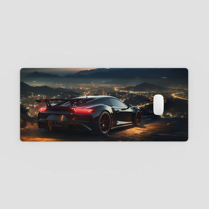 Phone case with a sports car on a mountain road at night, city lights in the background