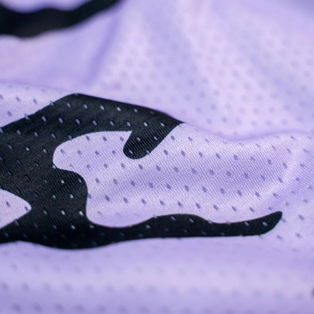 Purple mesh shorts with black pattern closeup
