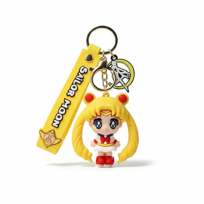 Keychain with Sailor Moon character and yellow strap on a white background