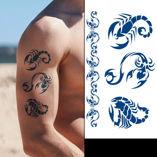Tattoo designs of a scorpion on a person's arm with additional designs on the right side.