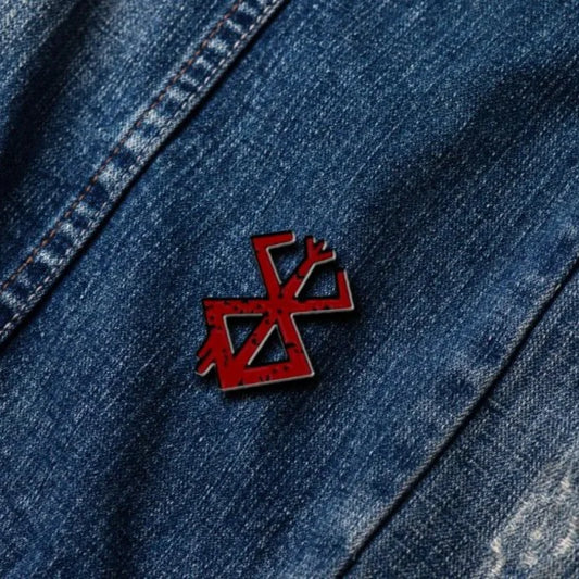 berserk brooch on denim jeans