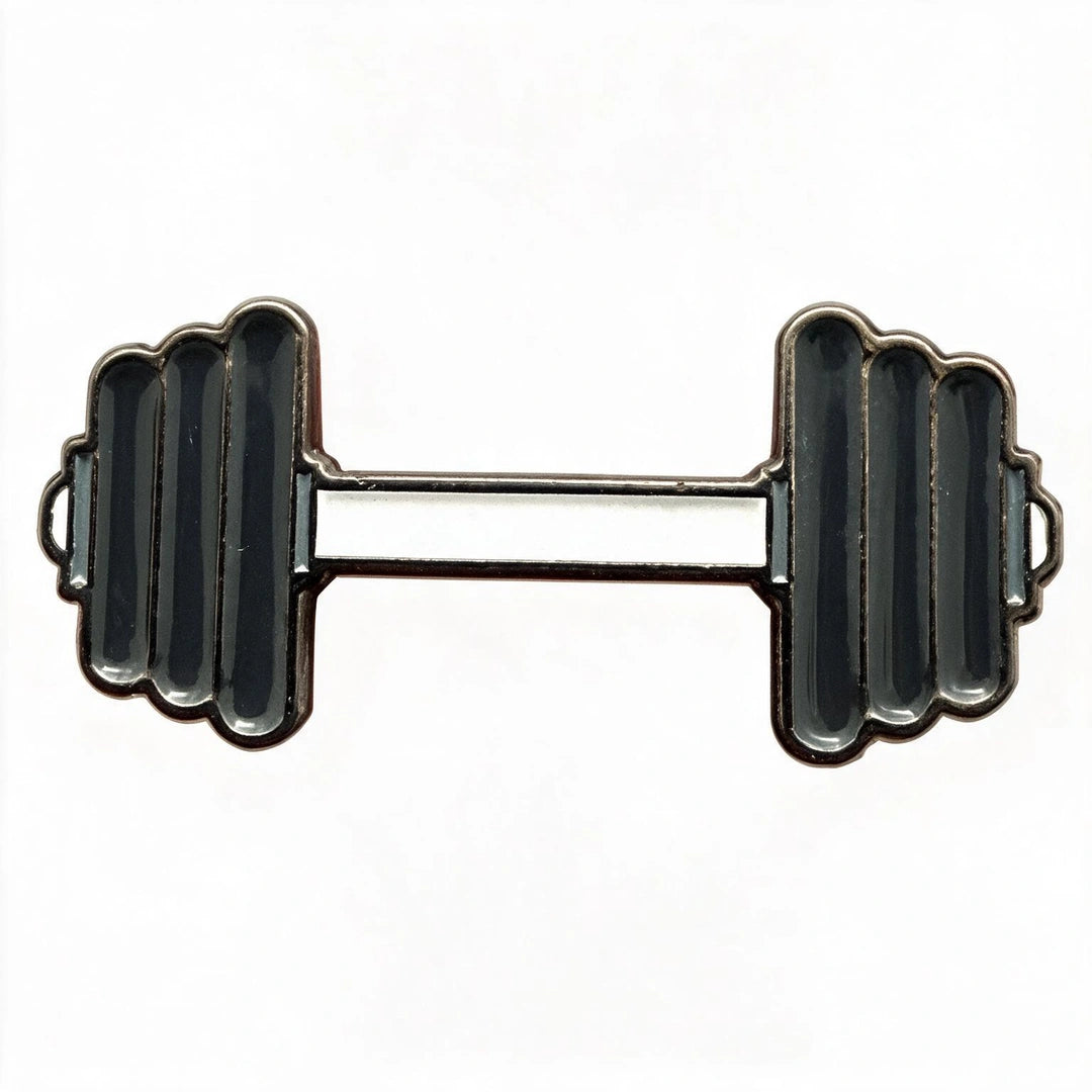 A novelty lapel pin shaped like a dumbbell, featuring a silver-tone metal outline with black enamel fill on the weight plates and handlebar, set against a plain white background.