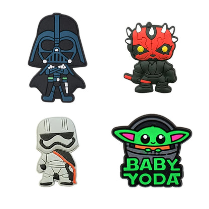 Four character figurines from Star Wars on a white background