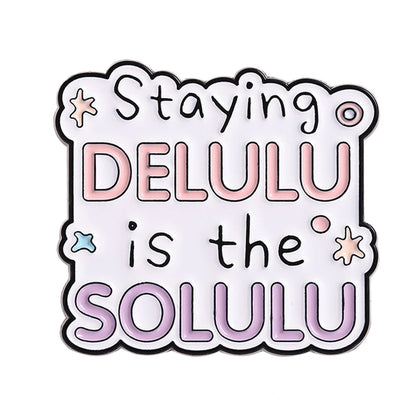 Sticker with text 'Staying DELULU is the SOLULU' on a white background