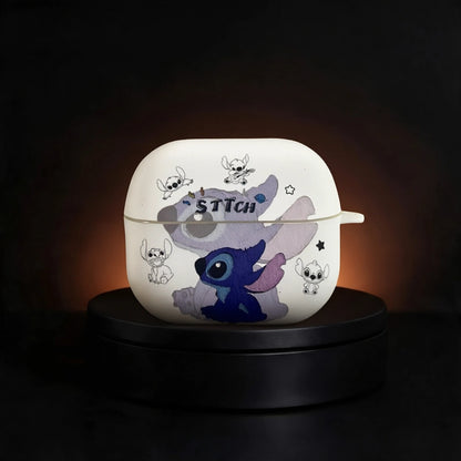 A white Galaxy Buds 3 and Buds 3 Pro case featuring a cartoon Stitch design, displayed on a black circular pedestal against a dark background.
