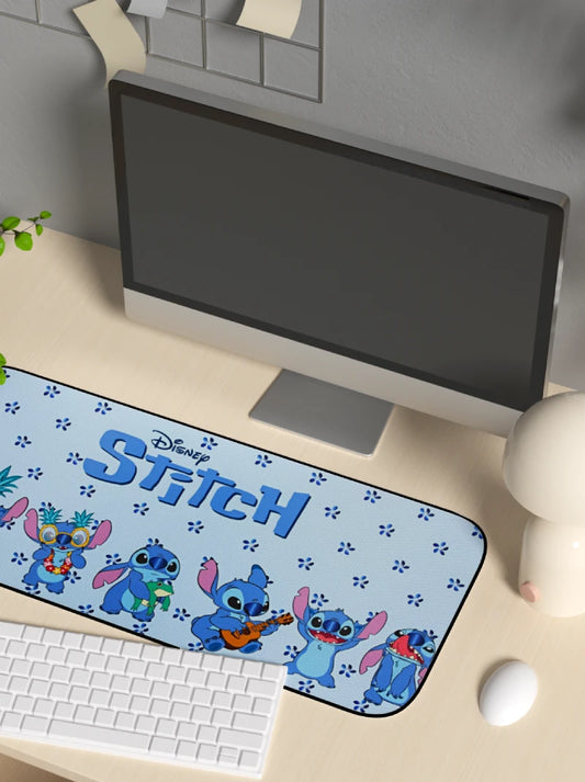 Computer desk setup with a Stitch-themed mouse pad