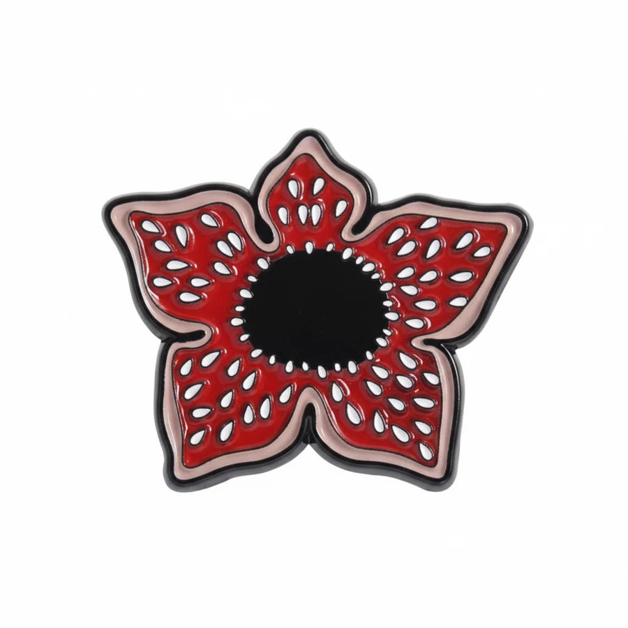 Red and black decorative item on a white background