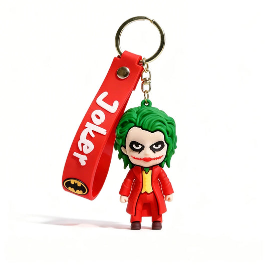 Keychain with Joker figure and red strap on a white background
