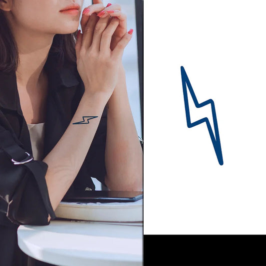 Woman with a lightning bolt tattoo on her arm, sitting on a white chair with a blue lightning bolt graphic 
